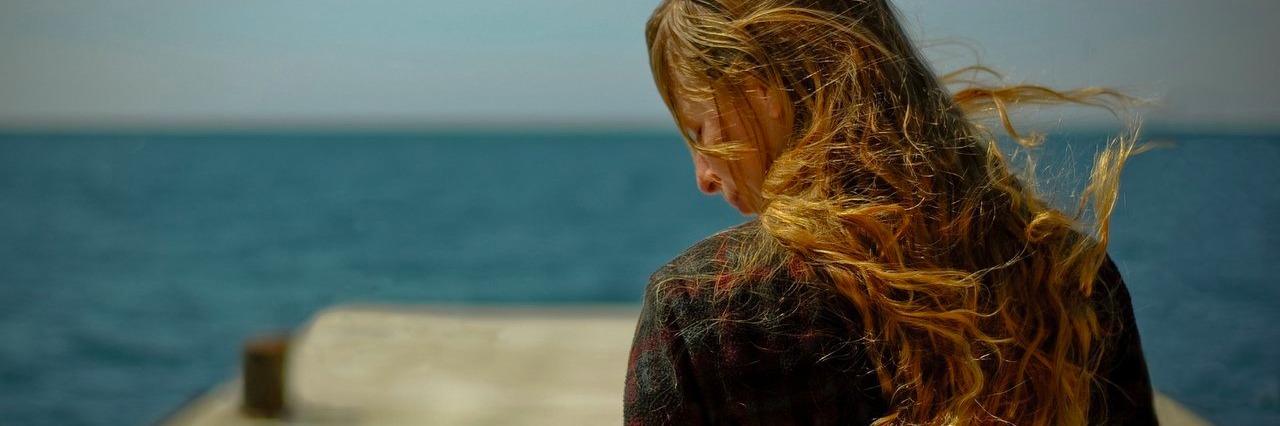 Chronic Illness: It Hurts When People Close to Me Call Me ‘Lazy’ young woman standing by the coast