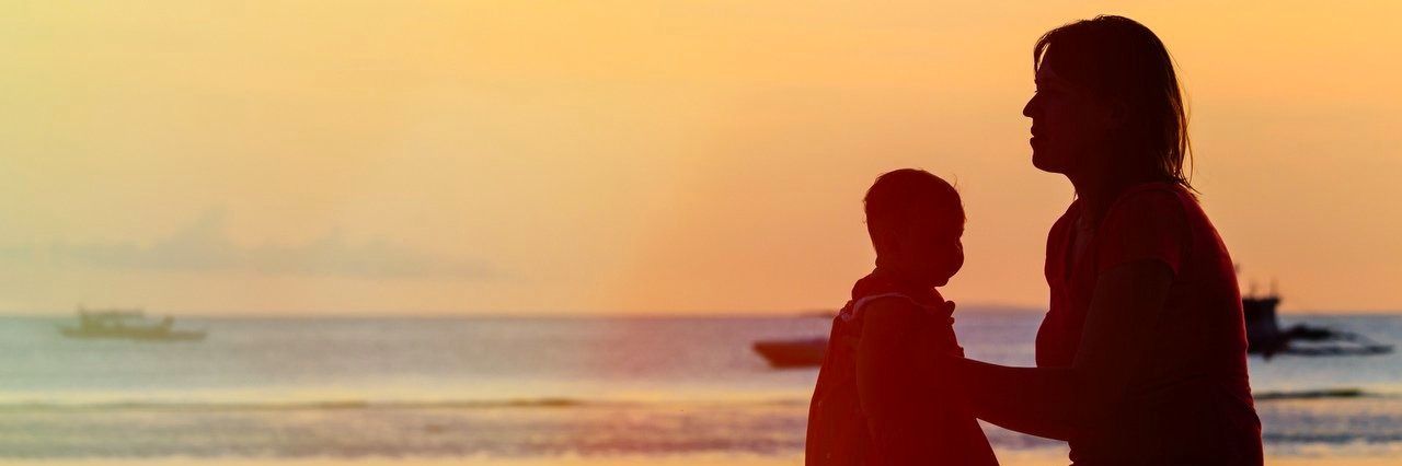 Down Syndrome: Mom Wishes for More Understanding About Baby’s Size mother and her baby at the beach during sunset