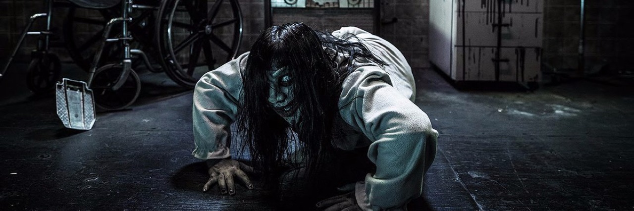 Mental Health Advocates Protest Knott's Berry Farm Fear VR: 5150 Promotional image of a scary girl coming out of a television screen.