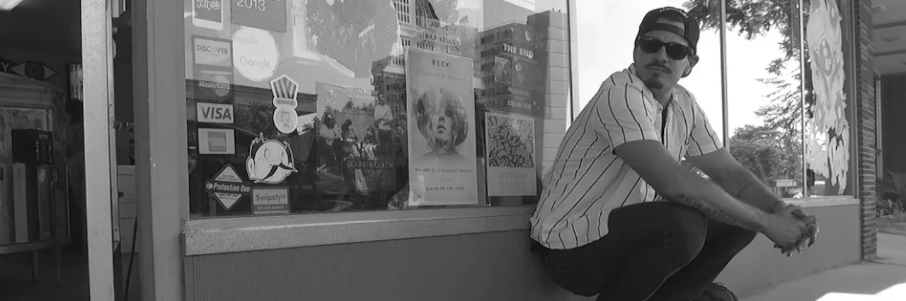 Quotes About Loving Someone With Addiction Man with sunglasses sitting on the sidewalk