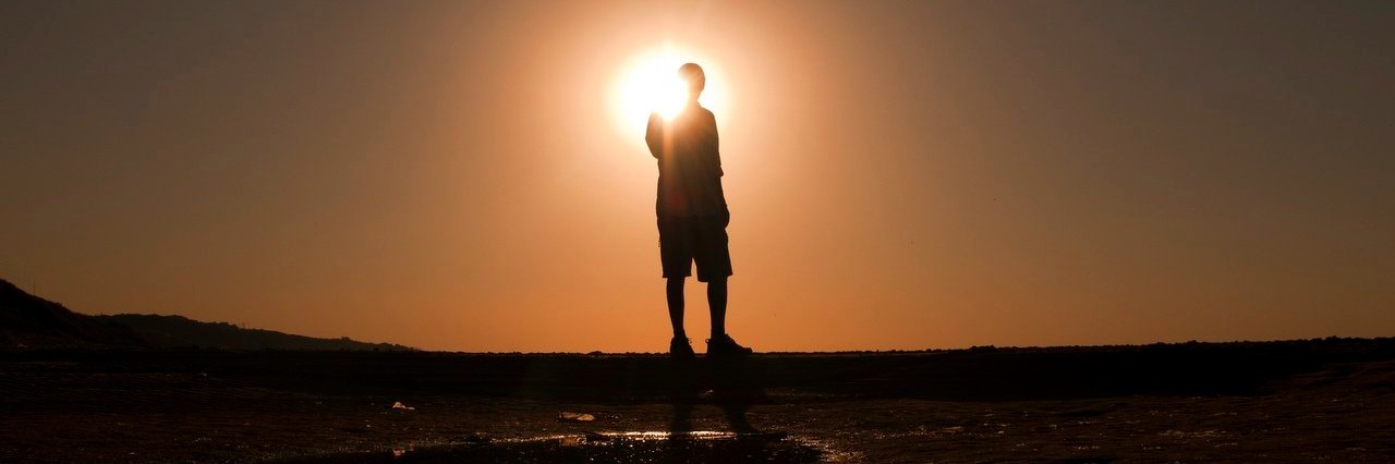 A Flashback About My Suicide Attempt Is Not a Setback man watching the sunset