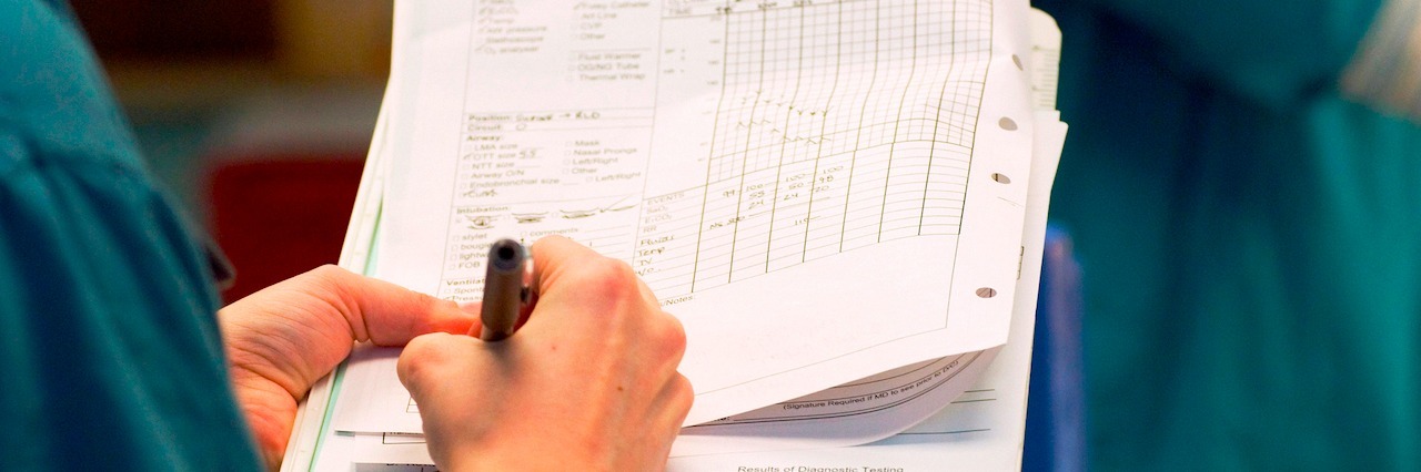 a doctor holding medical forms