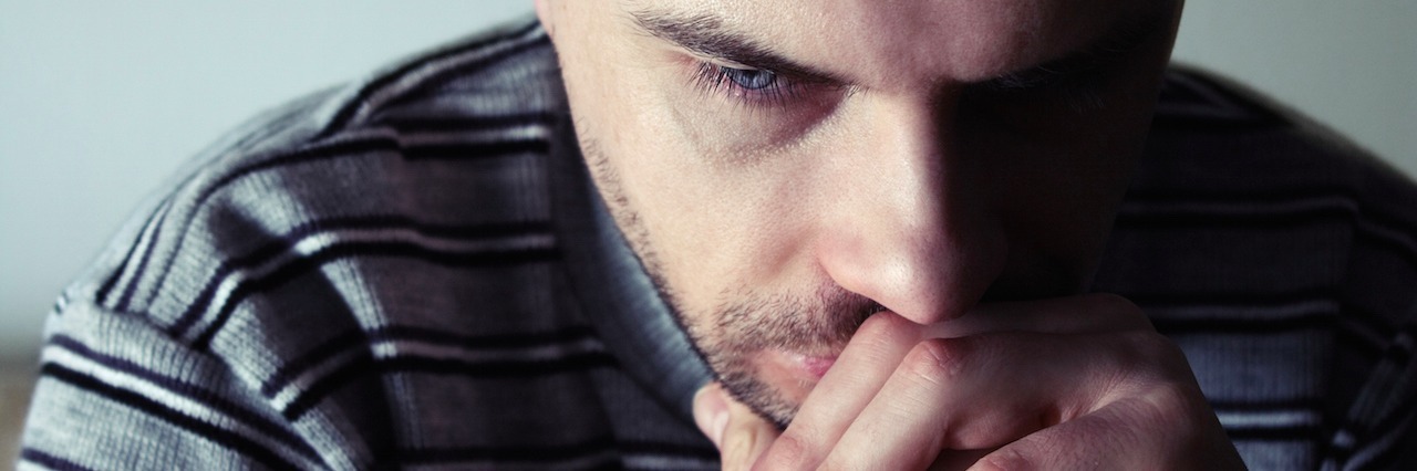 When the Suicidal Thoughts Don't Stop man with his head resting on his hands