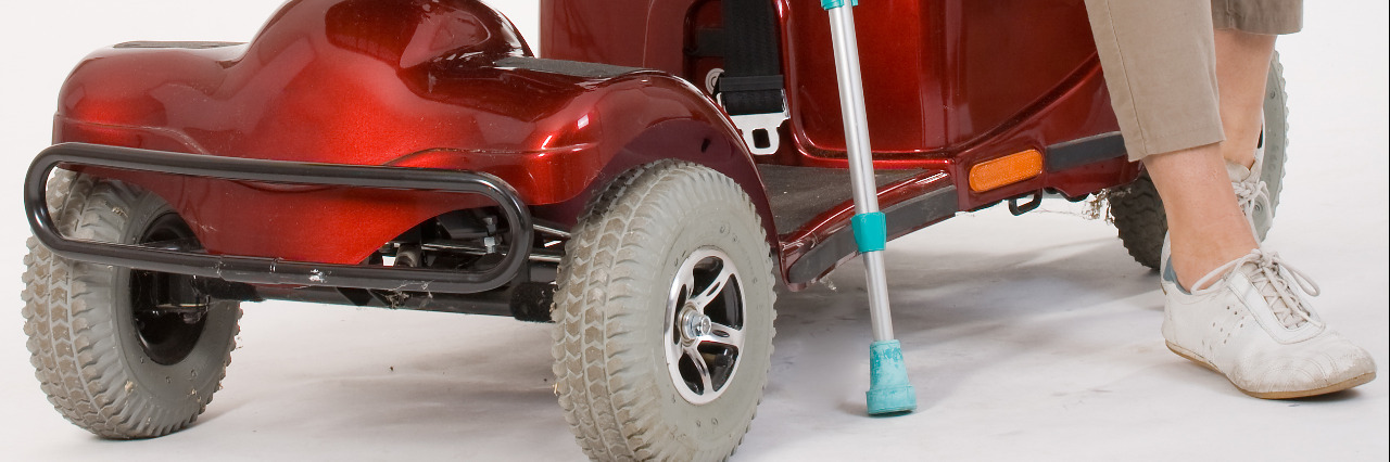 Things I Wish People With Ableist Beliefs Understood About Disability Disabled woman with scooter and crutches.