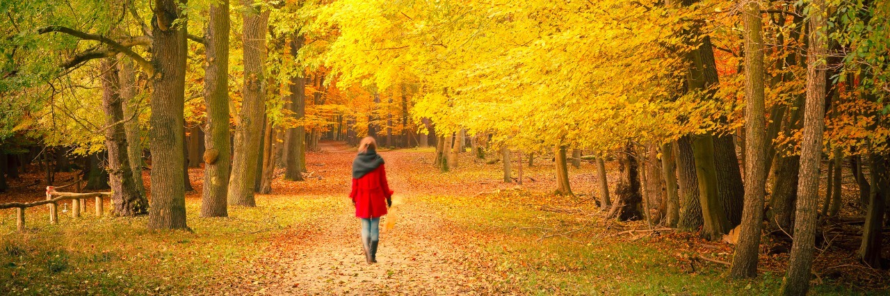 woman walking in a park in autumn