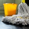 close up photograph of a mop and bucket with shallow depth of field