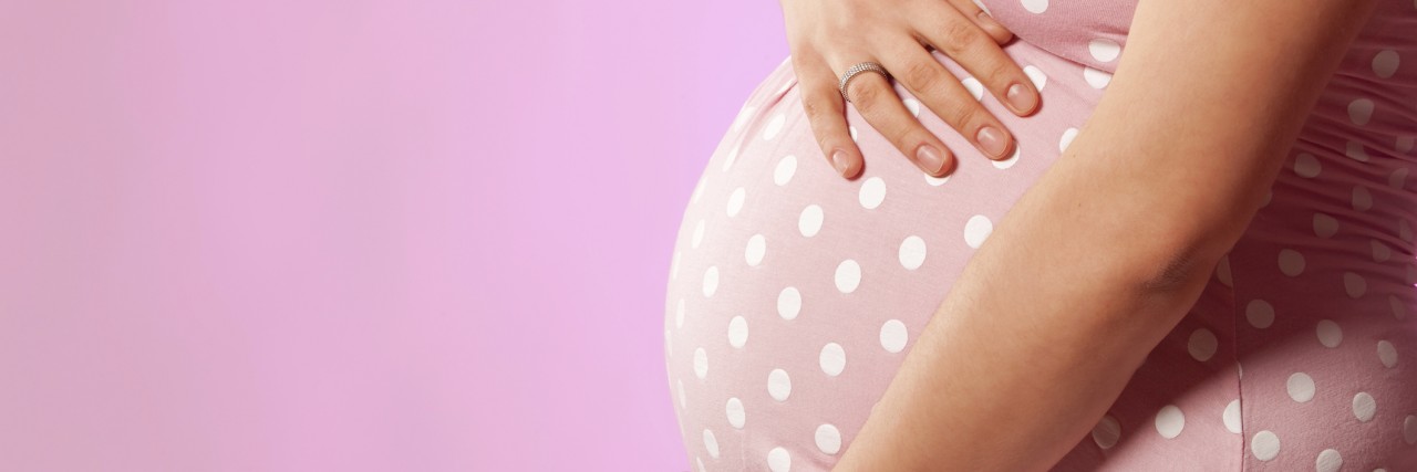 Letter to Mothers, From a Woman With Polycystic Ovary Syndrome pregnant woman in pink dress