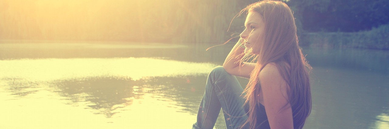 Vintage photo of relaxing young woman in nature