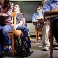 student sitting in desks in class