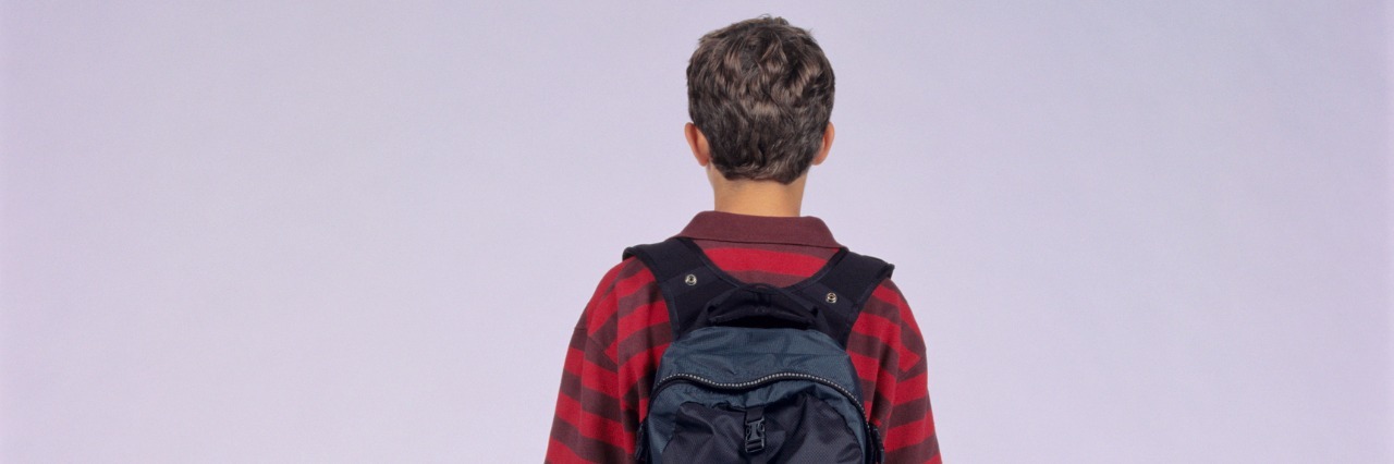 Mom Writes Letter to Autistic Son About Potential Group Home Placement Teenage boy (14-15) with rucksack, posing in studio