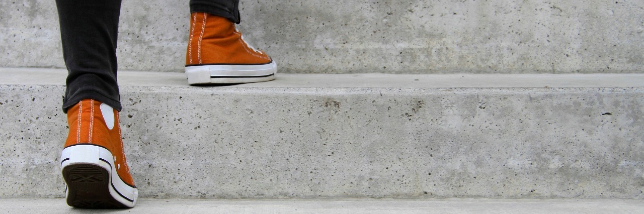 Building Confidence When You Have Mental Illness close up of man ascending stairs