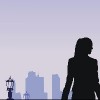 Silhouette of woman against purple sky and light posts