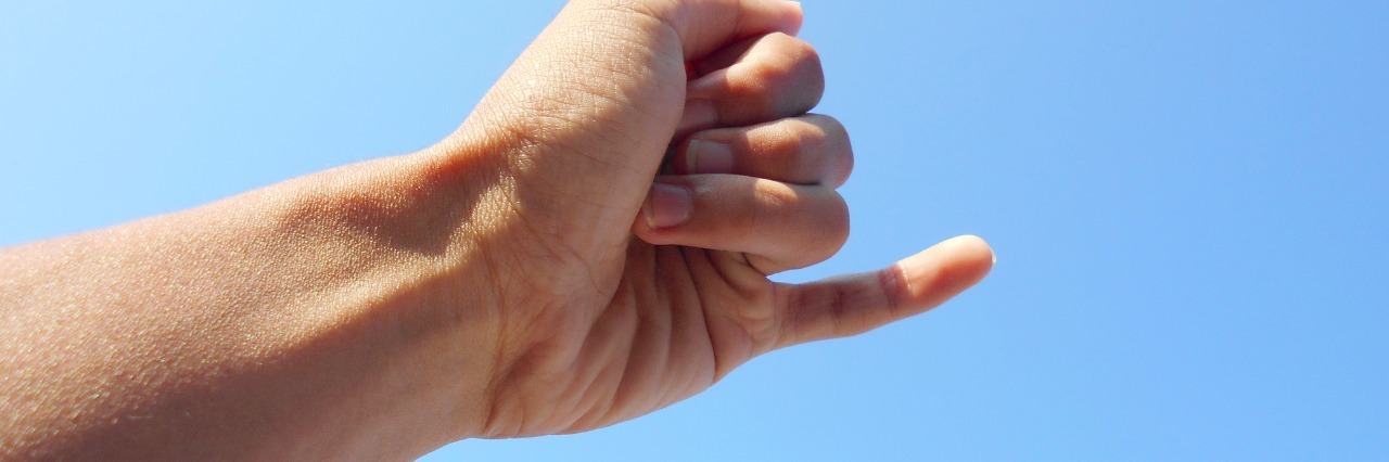 Advice for Stopping Negative Behaviors a hand reaching out for a pinky promise