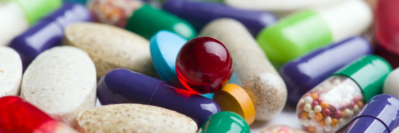 Side Effects of My Bipolar Disorder Medication pills isolated on white background