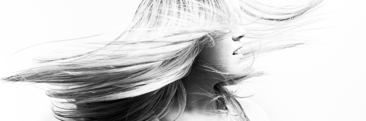 Why the Stereotype of Borderline Personality Disorder Is Wrong a woman with her hair blowing in front of her face