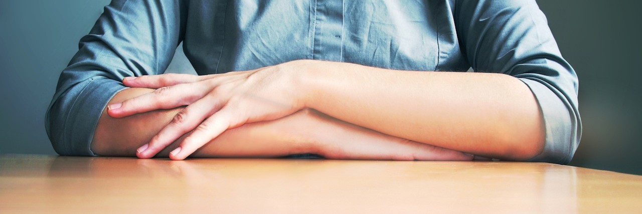 Apologizing Too Much With Borderline Personality Disorder woman with her hands folded