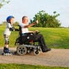 Disabled father rollerblading with son