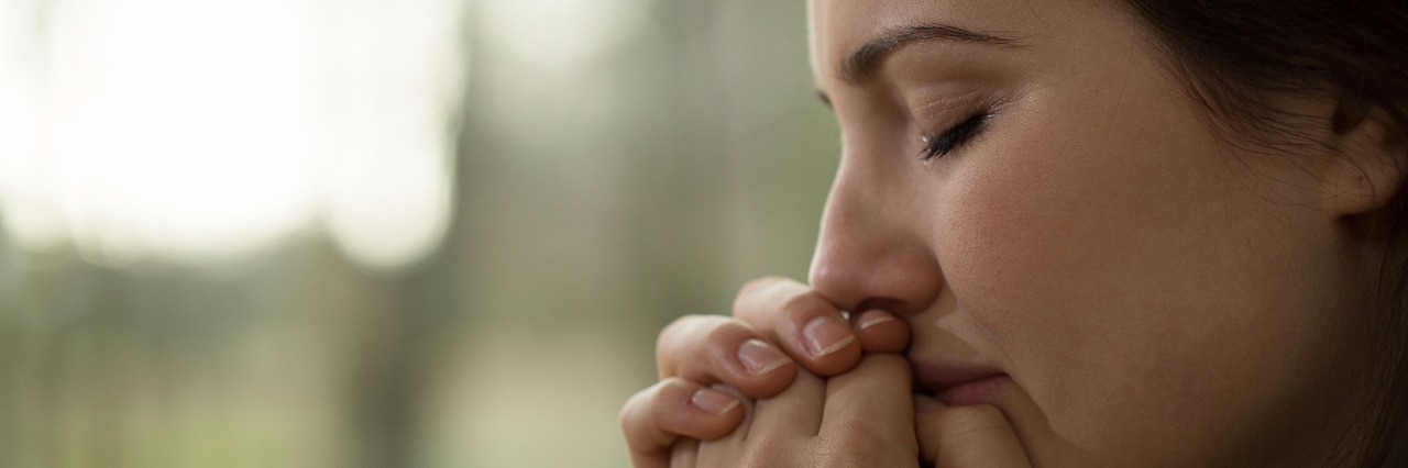 The First Time I Cried With Cushing's Syndrome Horizontal view of young woman crying