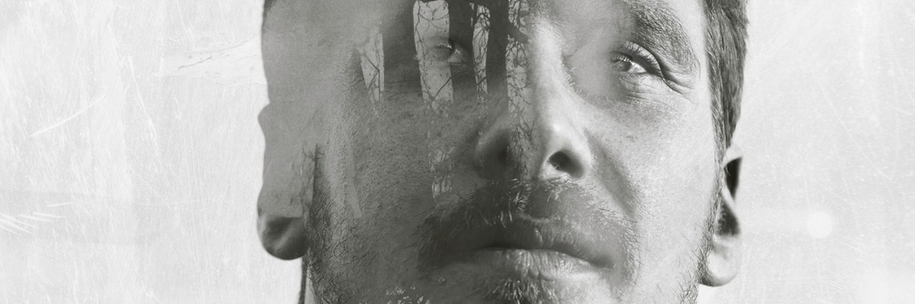 How to Motivate Yourself When You Live With a Mental Illness man standing in front of trees