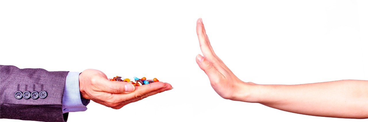 Why Supplements Won't Solve All Problems With Chronic Illness Man selling a medicine and woman refuses him.