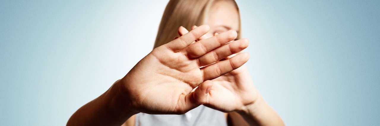 How to Act Around a Friend With a Mental Illness woman with her hands out