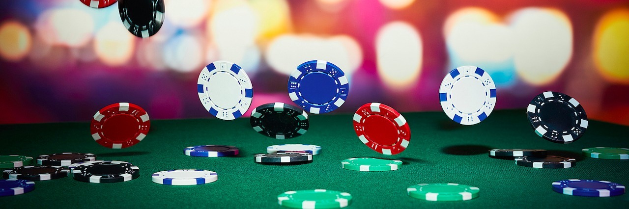 poker chips falling onto a poker table
