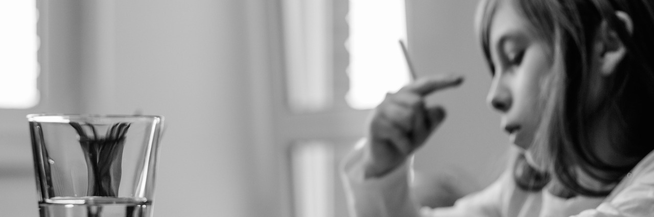 Showing Empathy to Students Dealing With Mental Illness and Medication student writing at a desk