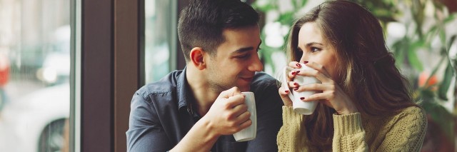 couple drinking coffee at a cafe