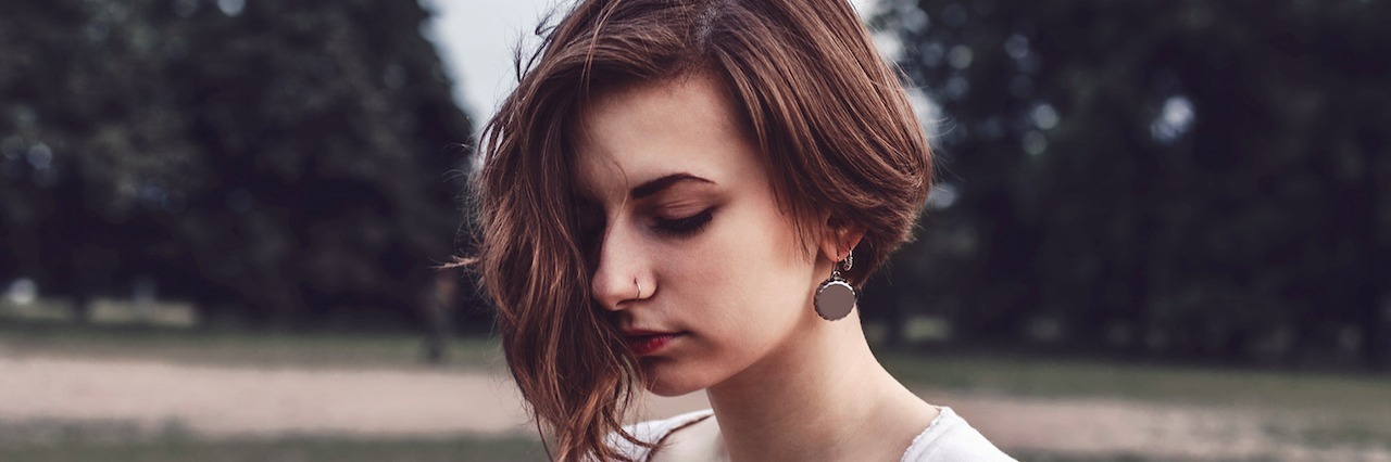 What Happens When You Dissociate When You're Depressed woman outside