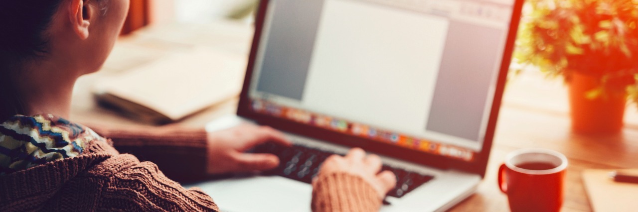 Experiencing 'Burnout' in the Workplace as an Autistic Person Woman working on a laptop