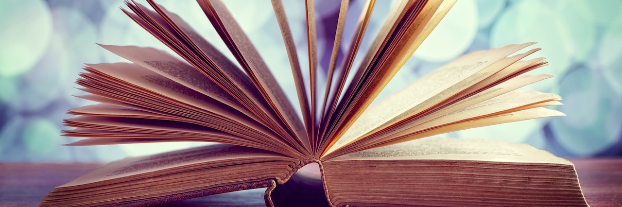 Suicide Prevention: Your Story Matters book open on a table