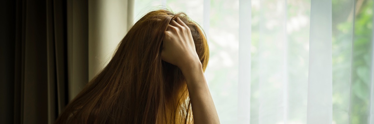 What Not to Say to Someone With Anxiety or Depression sad girl looking out of window