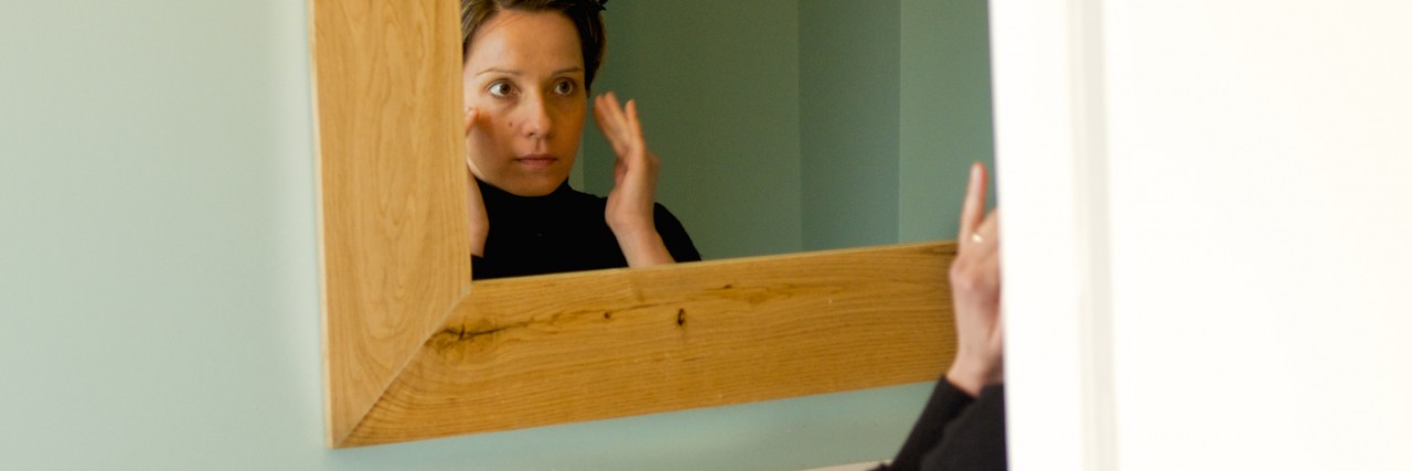 Bulimia Nervosa: When I Stop Fighting My Eating Disorder Label woman looks at the mirror while and dab cream, on the bathroom