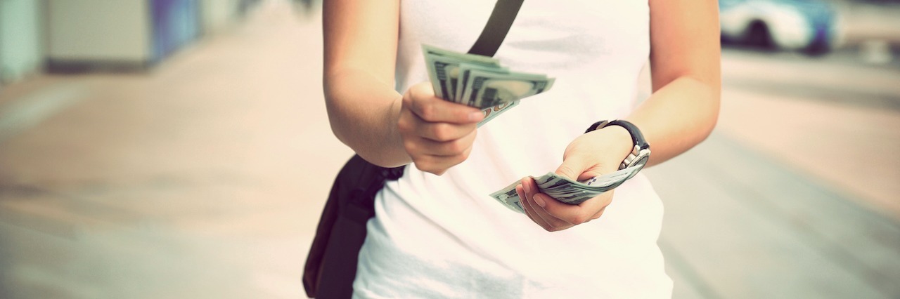 How 'Functioning' in Depression Keeps Me From Receiving Financial Aid woman counting money