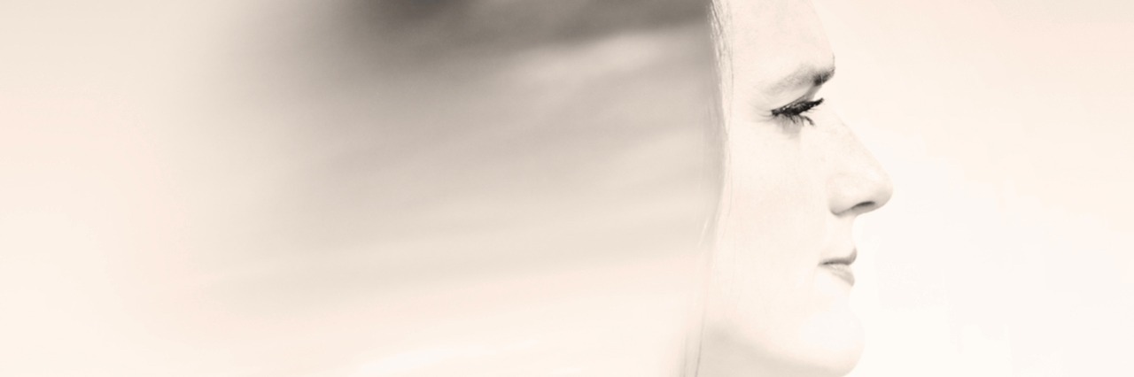 What It Is Like to Live With Chronic Anxiety woman with her hair blurred