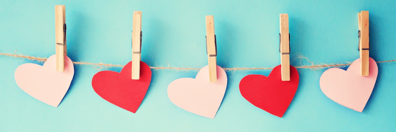 What It’s Like to Be in Love When You Have Anxiety paper hearts hanging from clothespins