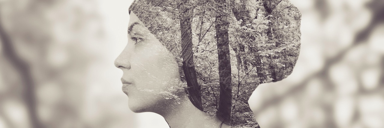 What You Remember on the Anniversary of a Suicide Attempt woman standing among trees