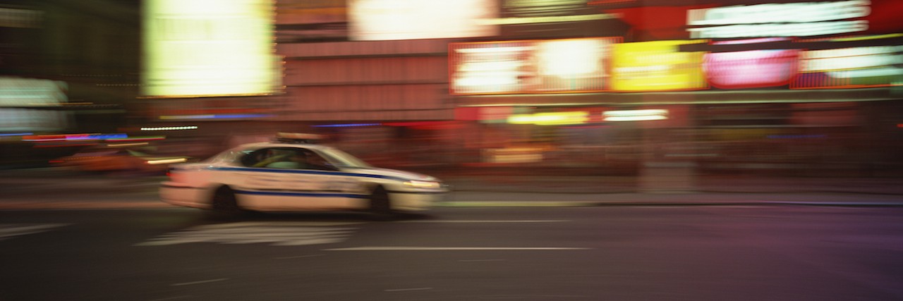 police car driving fast