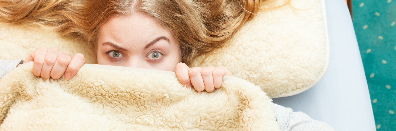 Overcoming Societal Fears About Blindness and Disability Hiding under a blanket.