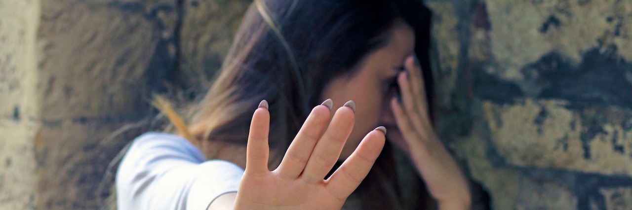 Common Misconceptions About Borderline Personality Disorder a woman with her hand out