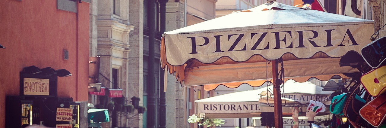 What Happened When I Traveled With an Eating Disorder pizzeria restaurant in street of Rome