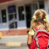 Back to school - little girl with backpack going to school or daycare
