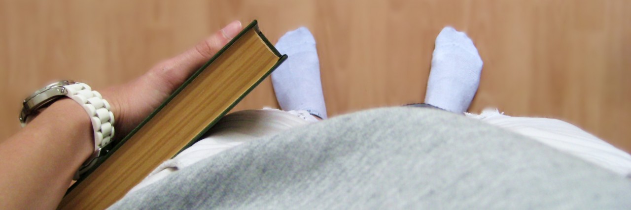 Student With Bipolar Disorder Writes Letter to Professors Reading and studying concept. Blurred background.