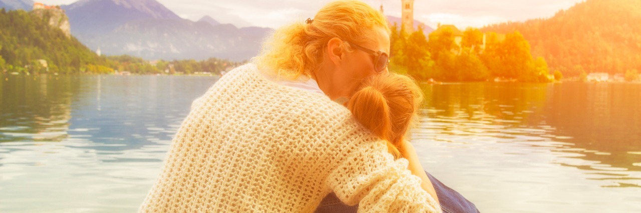Why I Can Still Be a Great Mother With a Disability Mother and daughter enjoying the view on a lake.