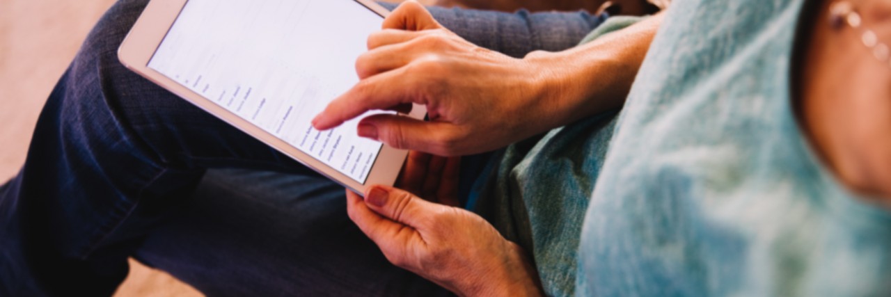 Letter to Friends and Family on Sharing Articles About Mental Illness Close-up of Woman using Digital Tablet at Home in Modern house