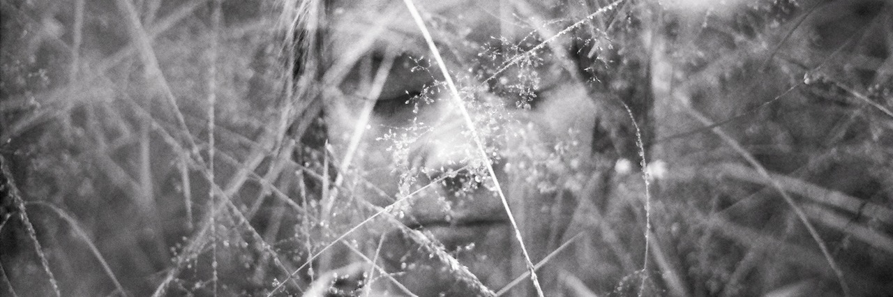 A Letter to the Person With Mental Illness girl in a field of tall grass