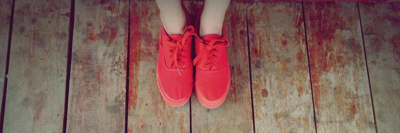 Variation of Symptoms of Borderline Personality Disorder women legs wearing red shoes walking on wooden floor