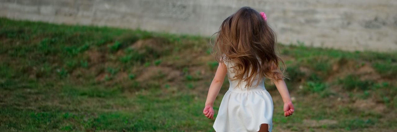 Mom Doesn't Mind Hearing 'I'm Sorry' About Child's Autism photo of little beautiful running girl outside