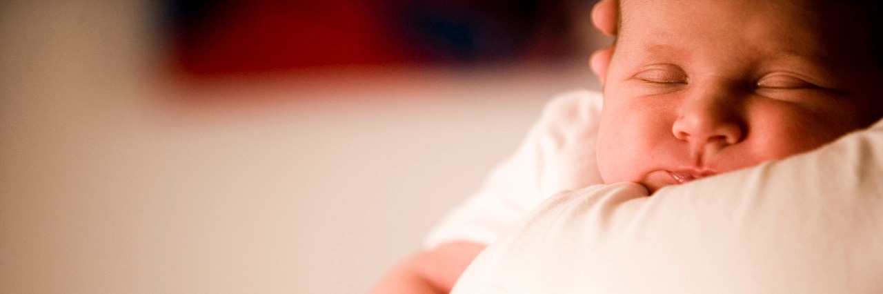 Postpartum Depression Makes You Think You Don't Want to Be a Mother A woman holding a baby