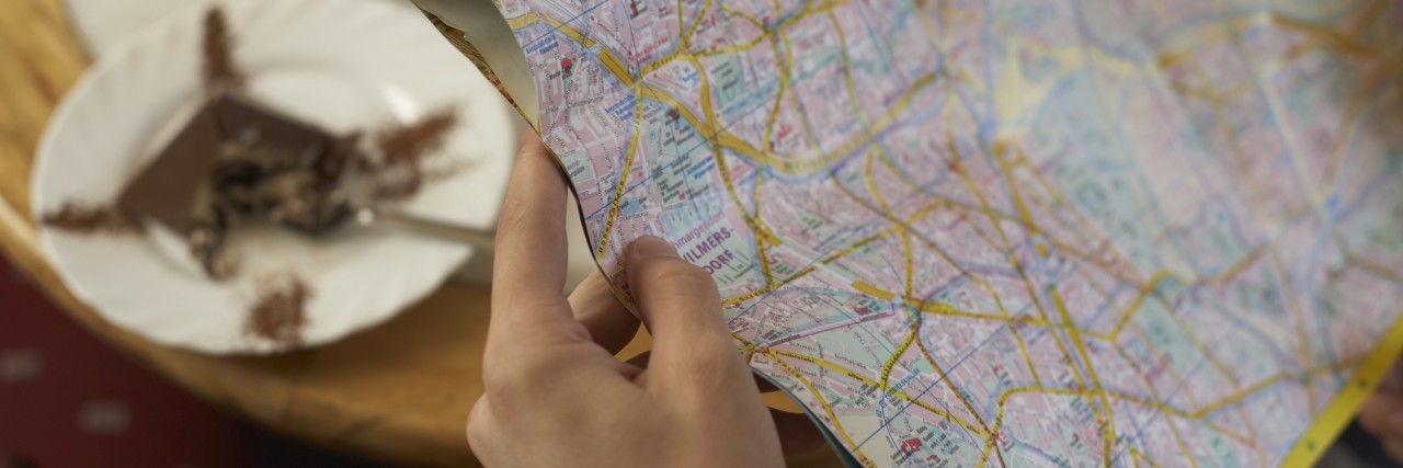 How to Help People With Anxiety When Going Out Woman holding road map